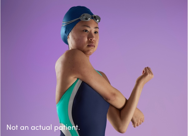 Teen girl swimmer wearing swim cap and goggles represents teenagers who should follow acne skincare tip 4: sun protection