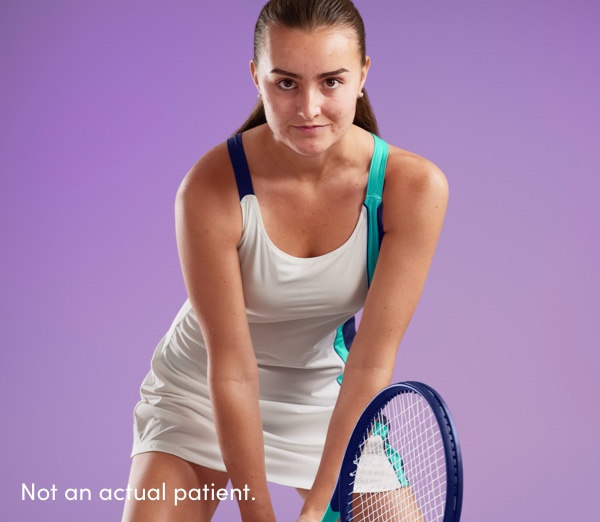 Teenage girl determined to return tennis serve represents confidence having clearer skin using AKLIEF® Cream acne medication