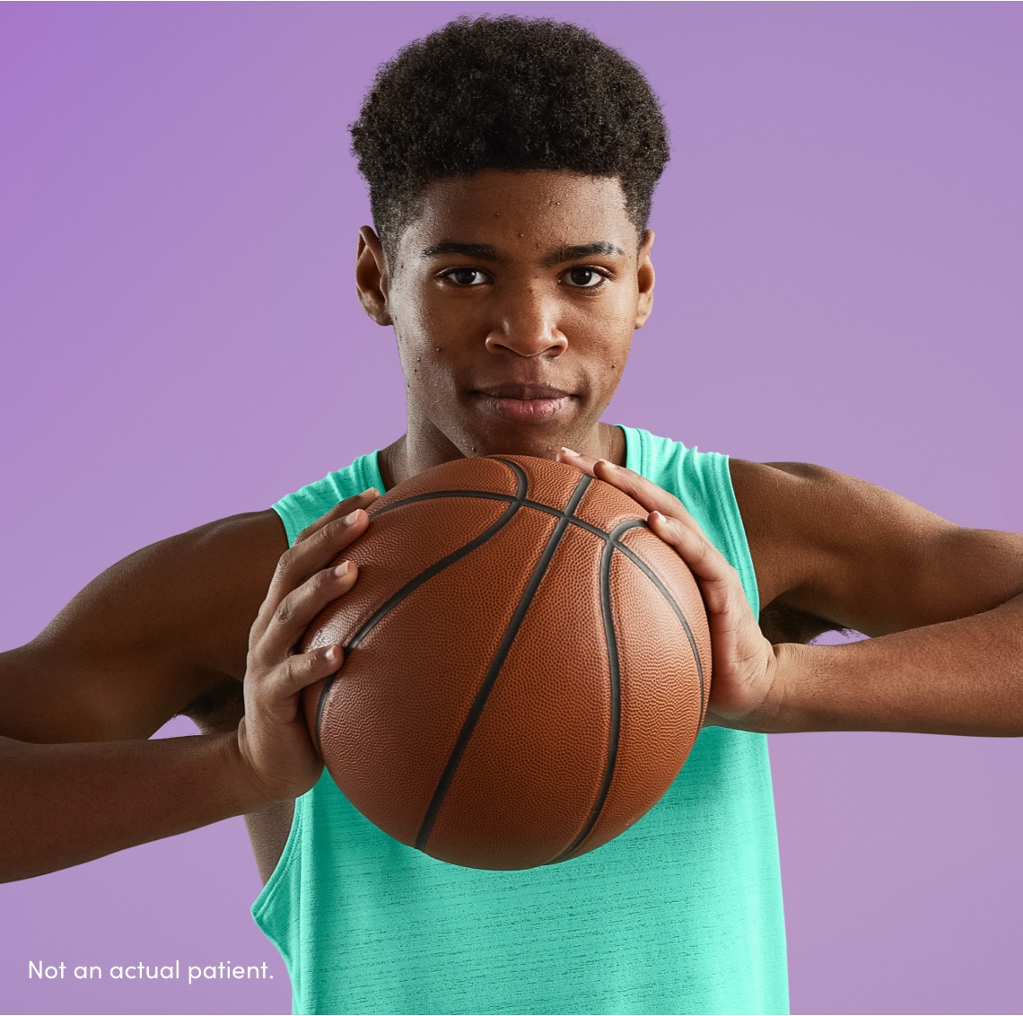 Male grasping basketball reflects teenage acne patients benefited as part of the AKLIEF® (trifarotene) Cream pivotal studies