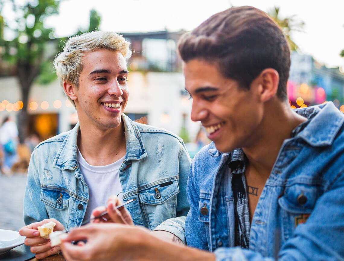 2 laughing teen boys represent acne relief after following talking points in the doctor discussion guide