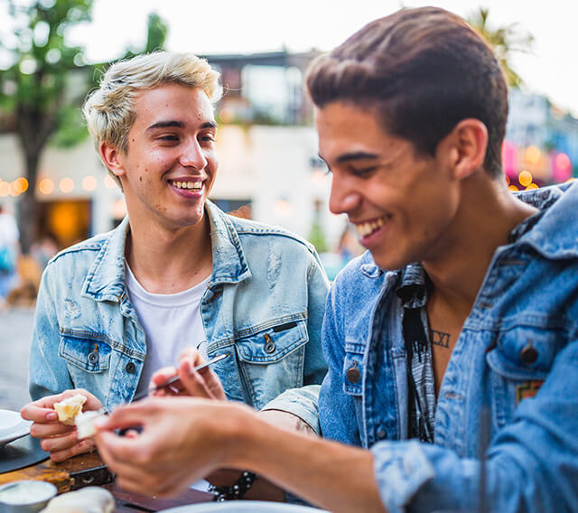 2 laughing teen boys represent acne relief after following talking points in the doctor discussion guide